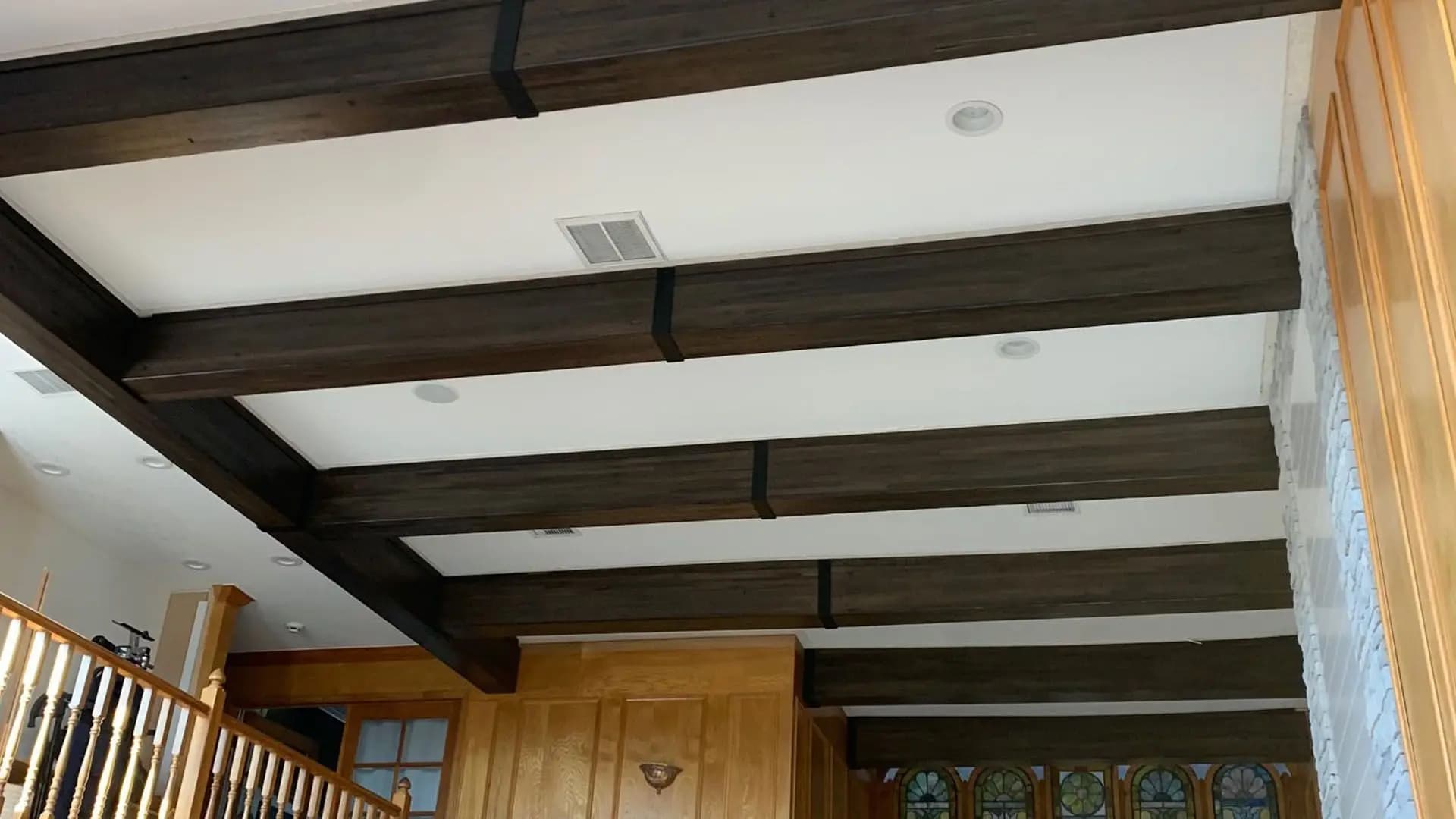 a ceiling with wood beams