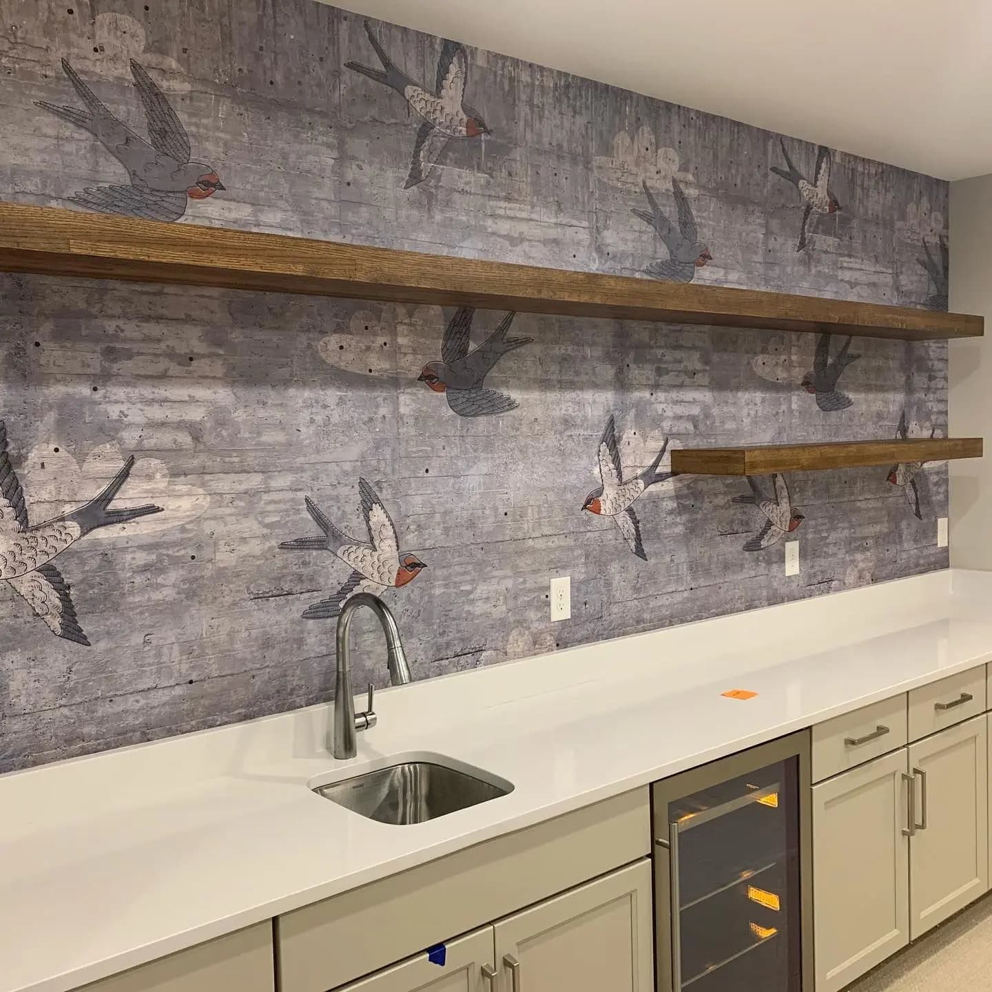 a kitchen with a sink and shelves