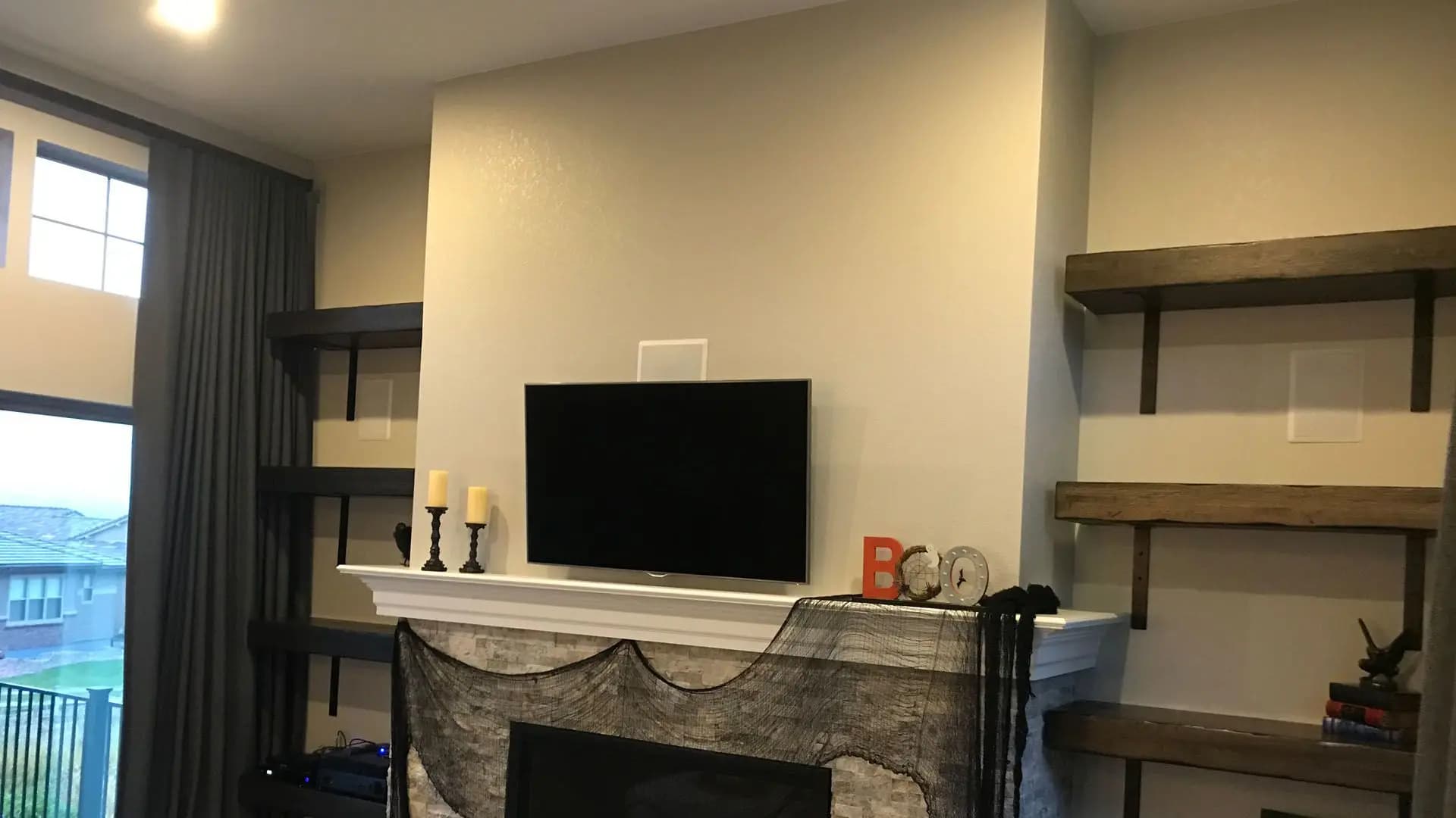 a tv on a fireplace