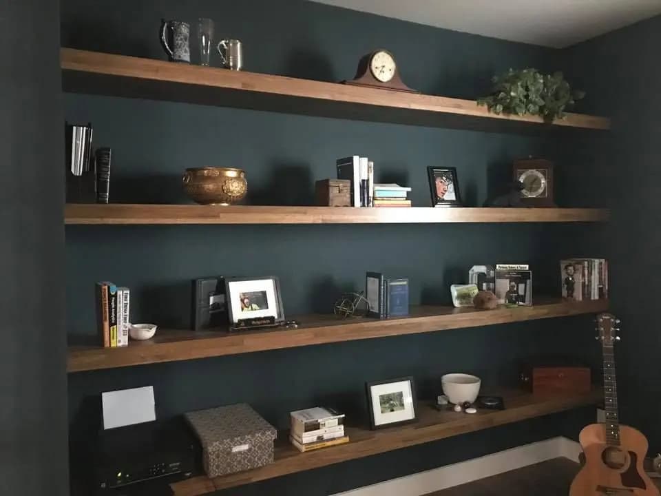 a shelf with books and objects on it