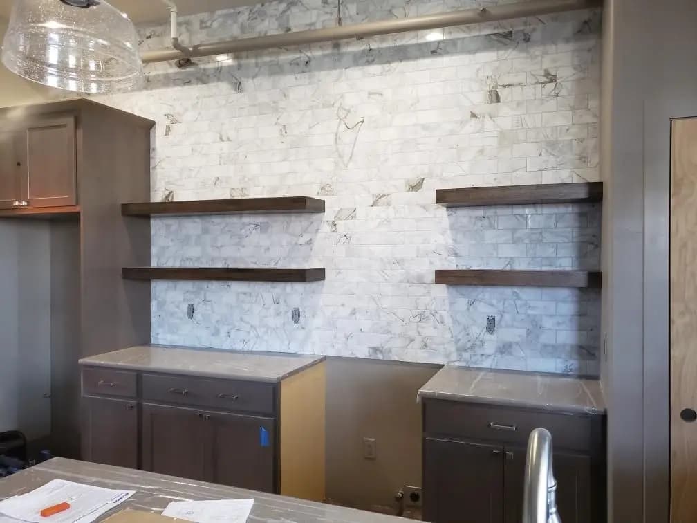 a shelf with marble walls and cabinets