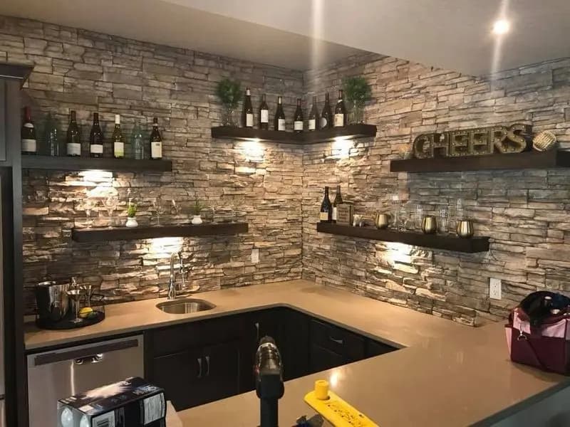 a kitchen with a bar and shelves