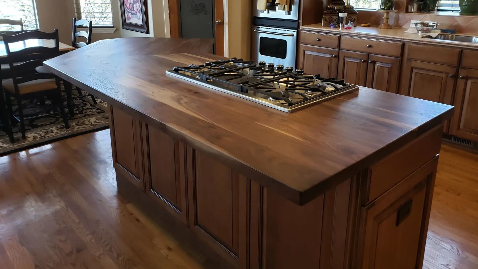 a kitchen with a wood island