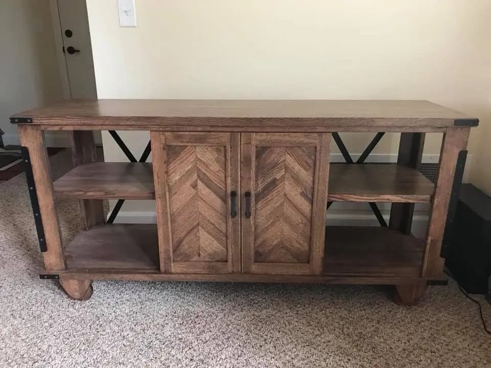 a wooden entertainment center in a room