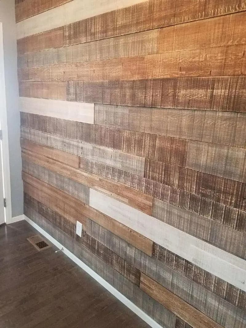 a wood wall with white trim