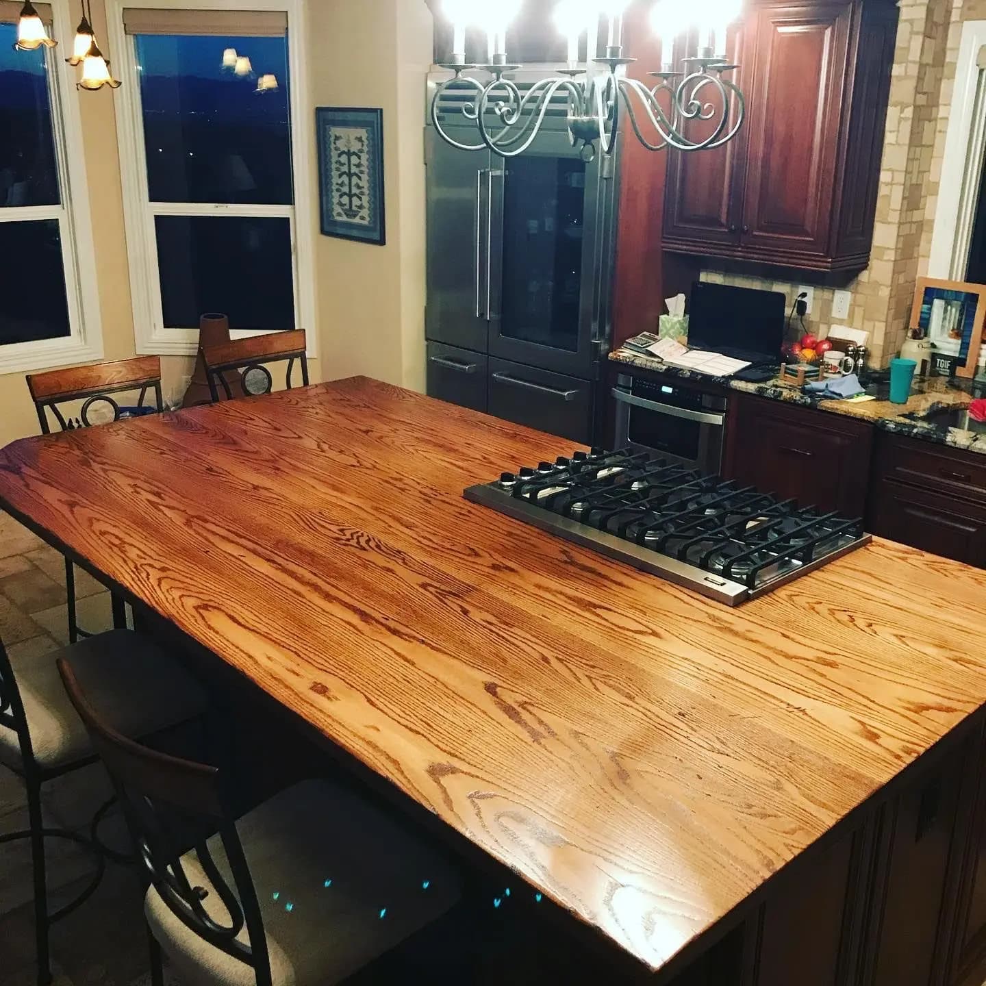 a kitchen with a large table and chairs