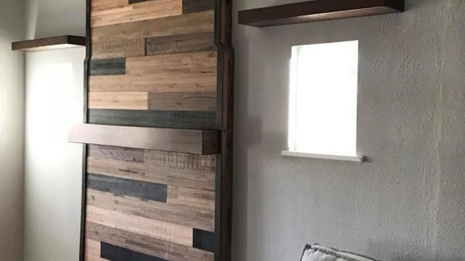 a wall with wood in a room