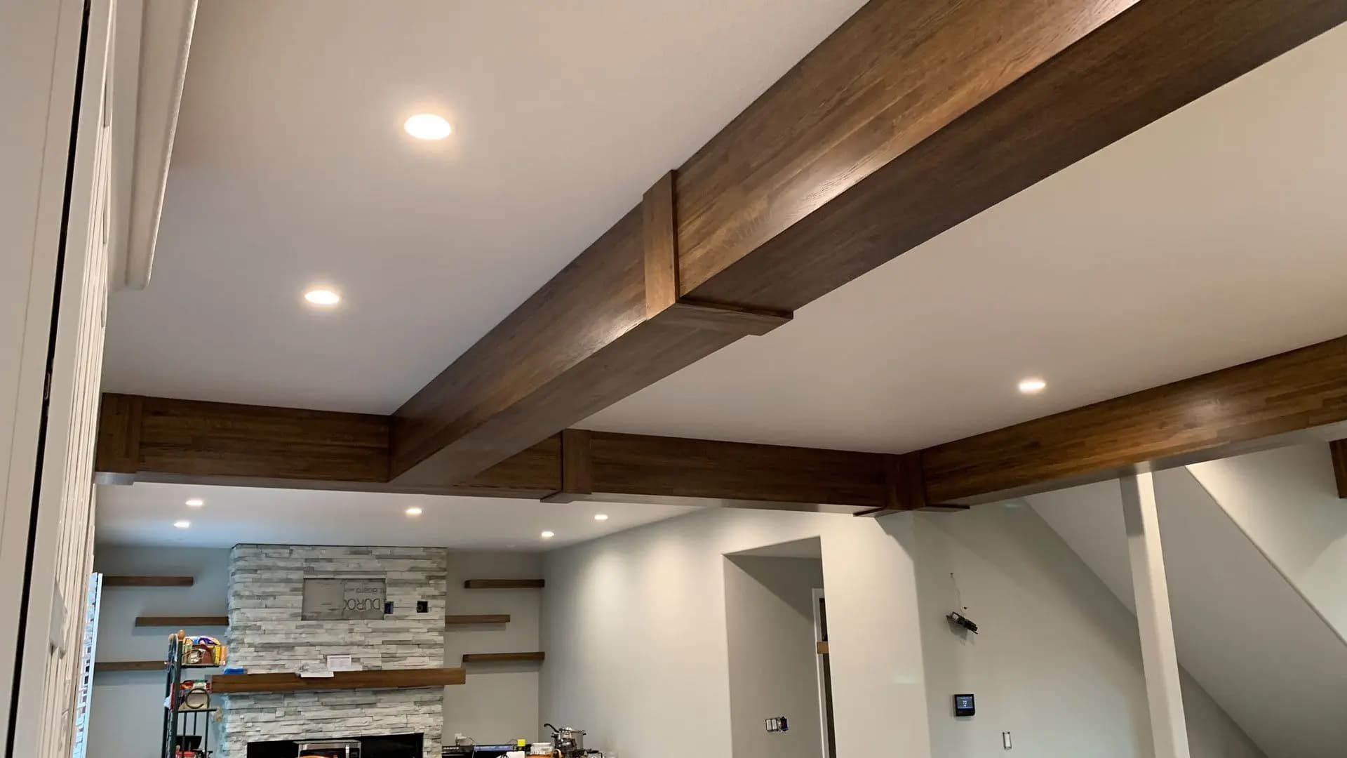 a ceiling with wood beams and lights