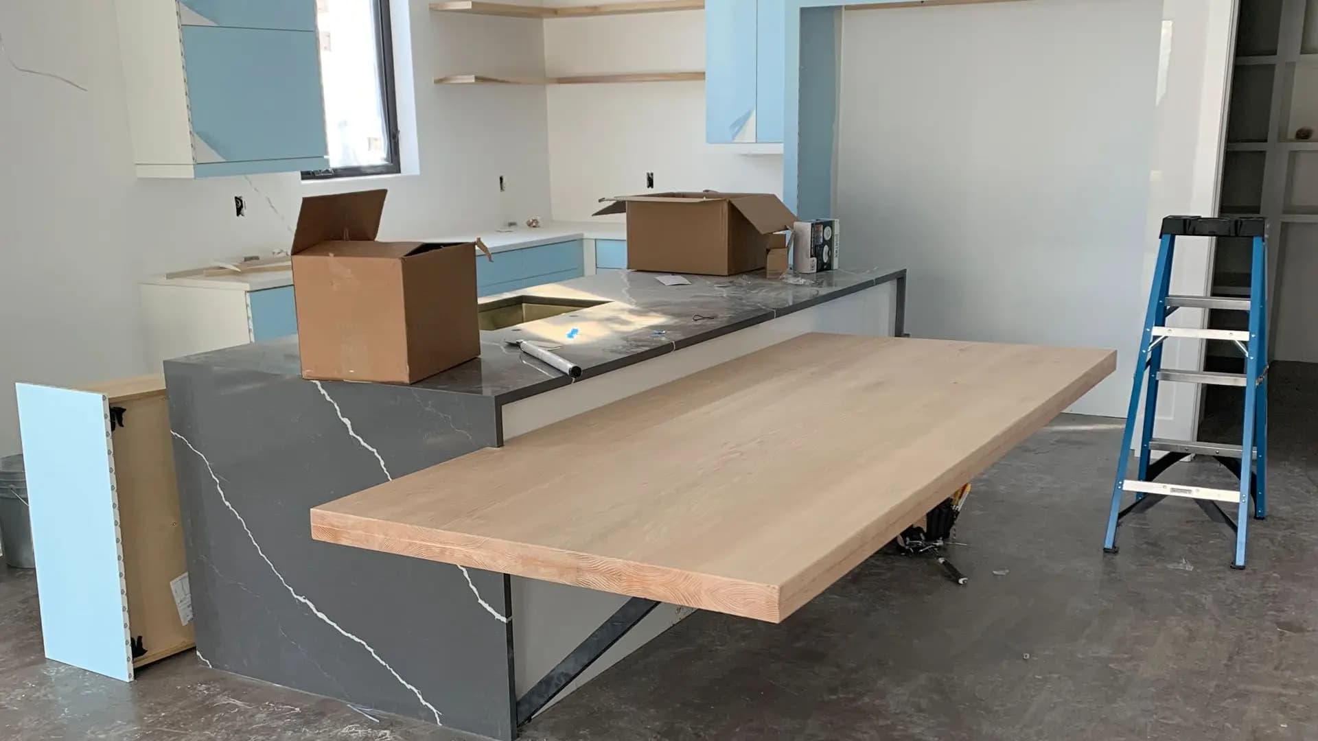 a counter top with a counter and boxes in the background