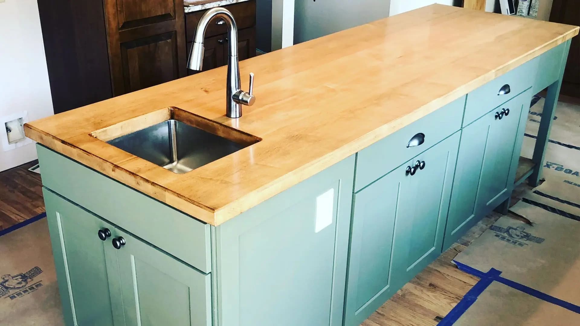 a kitchen island with a sink