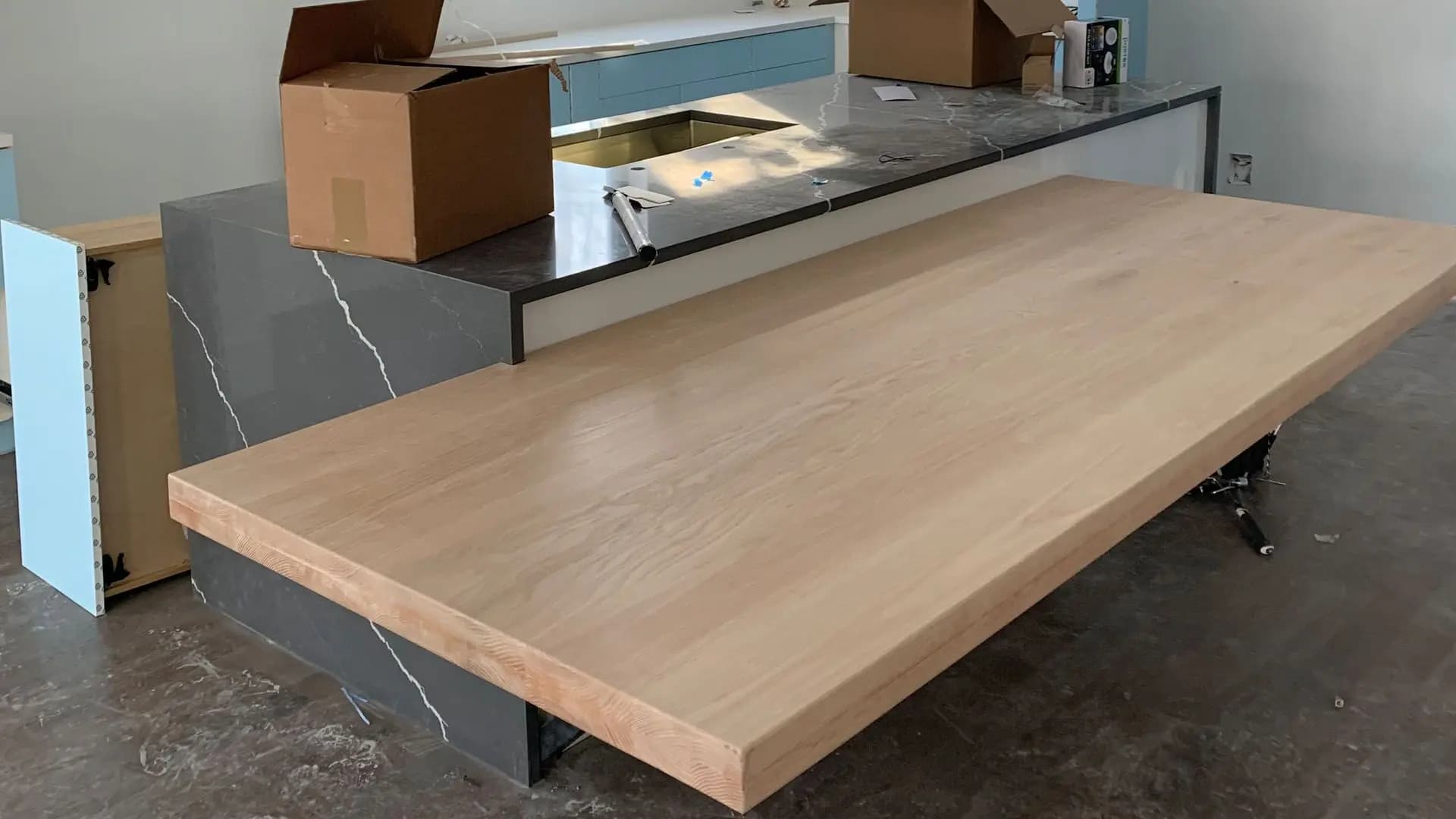 a counter top with a counter and boxes in the background